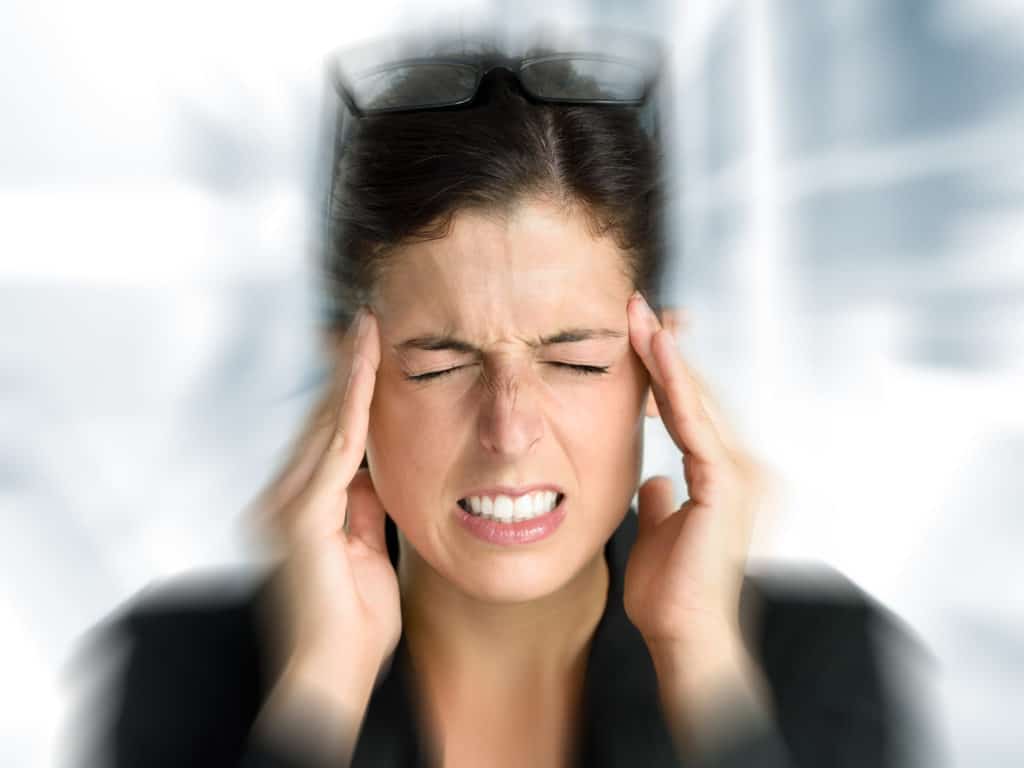 woman with head pain caused by concussion