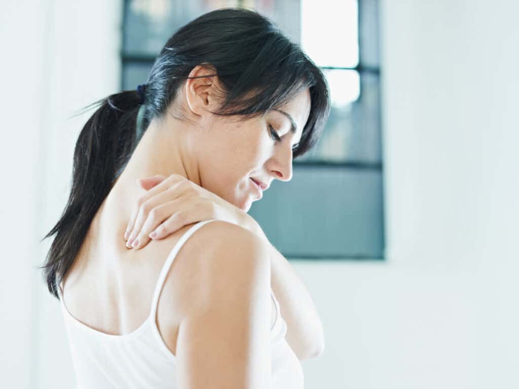 woman massaging neck. Side view, copy space